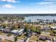 Aerial view of a lakefront community with houses and lush greenery at 6629 Travis Blvd, Tampa, FL 33610