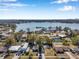 Aerial view of a home near a lake, showcasing the property and surrounding neighborhood at 6629 Travis Blvd, Tampa, FL 33610