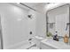 Modern bathroom with white subway tile and black fixtures at 6629 Travis Blvd, Tampa, FL 33610