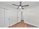 Bedroom with ceiling fan and access to bathroom at 6629 Travis Blvd, Tampa, FL 33610