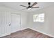 Bedroom with double door closet and ceiling fan at 6629 Travis Blvd, Tampa, FL 33610