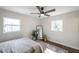 Bedroom with wood-look floors, ceiling fan and rug at 6629 Travis Blvd, Tampa, FL 33610