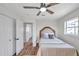 Bedroom with walk-in closet and ceiling fan at 6629 Travis Blvd, Tampa, FL 33610