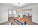 Bright dining room with wood table, bench seating, and kitchen view at 6629 Travis Blvd, Tampa, FL 33610