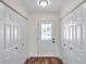 Bright entryway with wood-look floors and built-in storage at 6629 Travis Blvd, Tampa, FL 33610