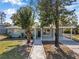 Charming house with a landscaped yard and walkway at 6629 Travis Blvd, Tampa, FL 33610