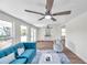 Living room features wood-look floors and ceiling fan at 6629 Travis Blvd, Tampa, FL 33610