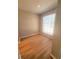 Bright bedroom with wood flooring and large window at 8609 Mallard Reserve Dr # 103, Tampa, FL 33614