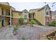 Exterior view of a two-story condo building with brick and siding at 8609 Mallard Reserve Dr # 103, Tampa, FL 33614