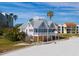 Beachfront property aerial view, showing a two-story house under renovation at 887 S Gulfview Blvd, Clearwater Beach, FL 33767