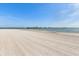 Scenic view of a wide sandy beach with calm waters at 887 S Gulfview Blvd, Clearwater Beach, FL 33767