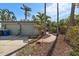 Two-car garage with walkway to the house entry at 887 S Gulfview Blvd, Clearwater Beach, FL 33767