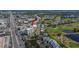 Aerial view of the condominium building with pool and surrounding golf course at 8950 Park Blvd # 406, Seminole, FL 33777