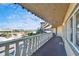 Wide angle view of condo balcony showing railing, trees, and horizon at 8950 Park Blvd # 406, Seminole, FL 33777