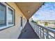 Exterior shot down condo balcony overlooking busy street and retail at 8950 Park Blvd # 406, Seminole, FL 33777