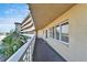 Exterior balcony view with white railing and building facade at 8950 Park Blvd # 406, Seminole, FL 33777