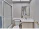 This cozy bathroom features white tiling and a vanity with a sink at 8950 Park Blvd # 406, Seminole, FL 33777