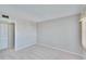 Well-lit, carpeted bedroom with closet and neutral paint at 8950 Park Blvd # 406, Seminole, FL 33777