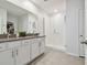 Modern bathroom with double vanity and large walk-in shower at 9114 Forge Breeze Loop, Wesley Chapel, FL 33545