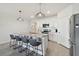 Modern kitchen with stainless steel appliances and granite countertops at 9114 Forge Breeze Loop, Wesley Chapel, FL 33545