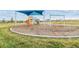 Community playground with shade structure, slides, and swings at 9114 Forge Breeze Loop, Wesley Chapel, FL 33545