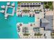 Aerial view of a resort-style pool area with lounge chairs and umbrellas at 9114 Forge Breeze Loop, Wesley Chapel, FL 33545