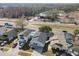 Aerial view of neighborhood with houses and a lake at 10323 Del Mar Cir, Tampa, FL 33624