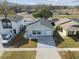 Aerial view of a house and surrounding neighborhood at 10323 Del Mar Cir, Tampa, FL 33624