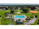 Community pool with surrounding park area at 10323 Del Mar Cir, Tampa, FL 33624