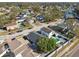 Aerial view of neighborhood with houses and a lake at 10323 Del Mar Cir, Tampa, FL 33624