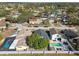 Aerial view of neighborhood with houses and a lake at 10323 Del Mar Cir, Tampa, FL 33624
