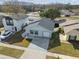 Aerial view of a house and surrounding neighborhood at 10323 Del Mar Cir, Tampa, FL 33624