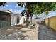 Backyard patio area with mature trees and partial fence at 10323 Del Mar Cir, Tampa, FL 33624