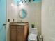 Small bathroom with granite vanity, toilet, and tiled walls at 10323 Del Mar Cir, Tampa, FL 33624