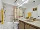 Clean bathroom with shower/tub and wood vanity at 10323 Del Mar Cir, Tampa, FL 33624