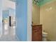 Small half bathroom with granite vanity and toilet at 10323 Del Mar Cir, Tampa, FL 33624