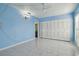 Blue walls and tile floors in this bright bedroom at 10323 Del Mar Cir, Tampa, FL 33624