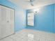 Light blue walls and tiled floors in this spacious bedroom with double closet at 10323 Del Mar Cir, Tampa, FL 33624