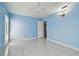 Blue walls and tile floors in this bright bedroom at 10323 Del Mar Cir, Tampa, FL 33624