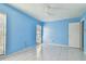 Blue walls and tile floors in this bright bedroom at 10323 Del Mar Cir, Tampa, FL 33624