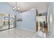 Bright dining area with access to patio and kitchen pass-through at 10323 Del Mar Cir, Tampa, FL 33624