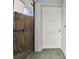 White front door with sidelights and a tiled entryway at 10323 Del Mar Cir, Tampa, FL 33624