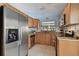 Updated kitchen featuring stainless steel appliances and wood cabinets at 10323 Del Mar Cir, Tampa, FL 33624