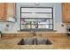 Modern double kitchen sink with granite countertop at 10323 Del Mar Cir, Tampa, FL 33624