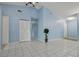 Spacious living room with tile floors and light blue walls at 10323 Del Mar Cir, Tampa, FL 33624
