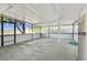 Covered patio with concrete flooring and screened enclosure at 10323 Del Mar Cir, Tampa, FL 33624
