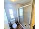 Simple bathroom with toilet and shower/tub combo at 12501 Ulmerton Rd # 188, Largo, FL 33774