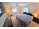 Spacious Primary bedroom with king-size bed and ensuite access at 12501 Ulmerton Rd # 188, Largo, FL 33774