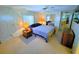 Comfortable bedroom with a queen-size bed and ample closet space at 12501 Ulmerton Rd # 188, Largo, FL 33774