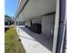 Covered patio with concrete slab and grassy area at 12501 Ulmerton Rd # 188, Largo, FL 33774